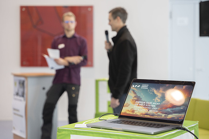 Two speakers in front of an audience